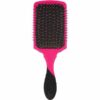 Wet Brush Pro Paddle Detangler Brush Pink glides effortlessly through the hair, detangling and removing snags with less pain and breakage. With an expanded cushion area for faster detangling, this brush also features ultra-soft Intelliflex® bristles which are perfect for use on all hair types and textures. The AquaVent™ design also allows for fast water drainage and easy cleanup. The ergonomic design features finger rests and a rubberised EasyGrip™ handle for enhanced comfort and control. Can also be used on real and synthetic extensions.